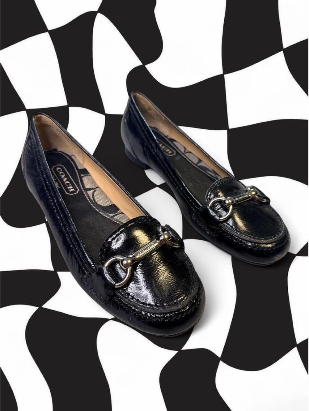 Coach black patent leather loafers with silver buckle detail
